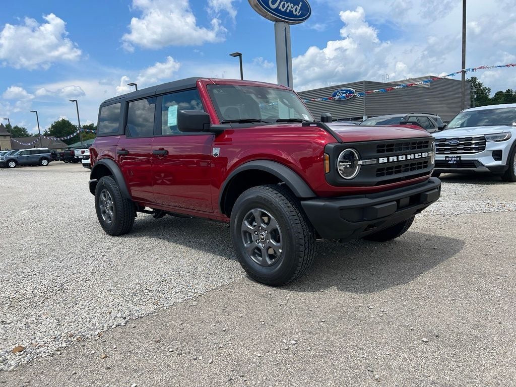 2026 Ford Bronco Big Bend in Ruby Red Metallic Tinted Clearcoat — front three-quarter view