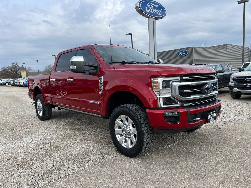 2022 Ford F-250 Platinum in Rapid Red Metallic Tinted Clearcoat — front three-quarter view