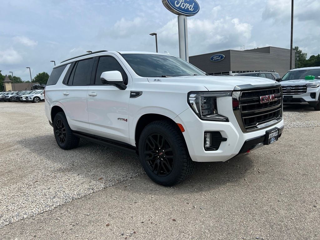 2023 GMC Yukon AT4 in Summit White — front three-quarter view