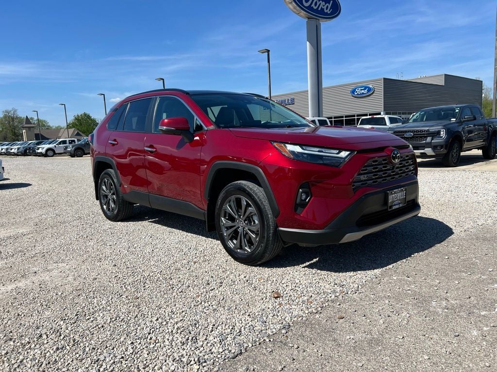 2025 Toyota RAV4 Hybrid Limited in Ruby Flare Pearl — front three-quarter view